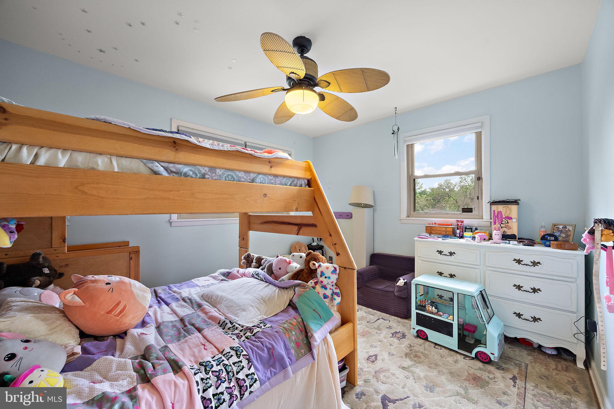 601 Riverview Road Claymont, DE 19703 - Photo 20 of 33 a bed room with a bed and a chandelier