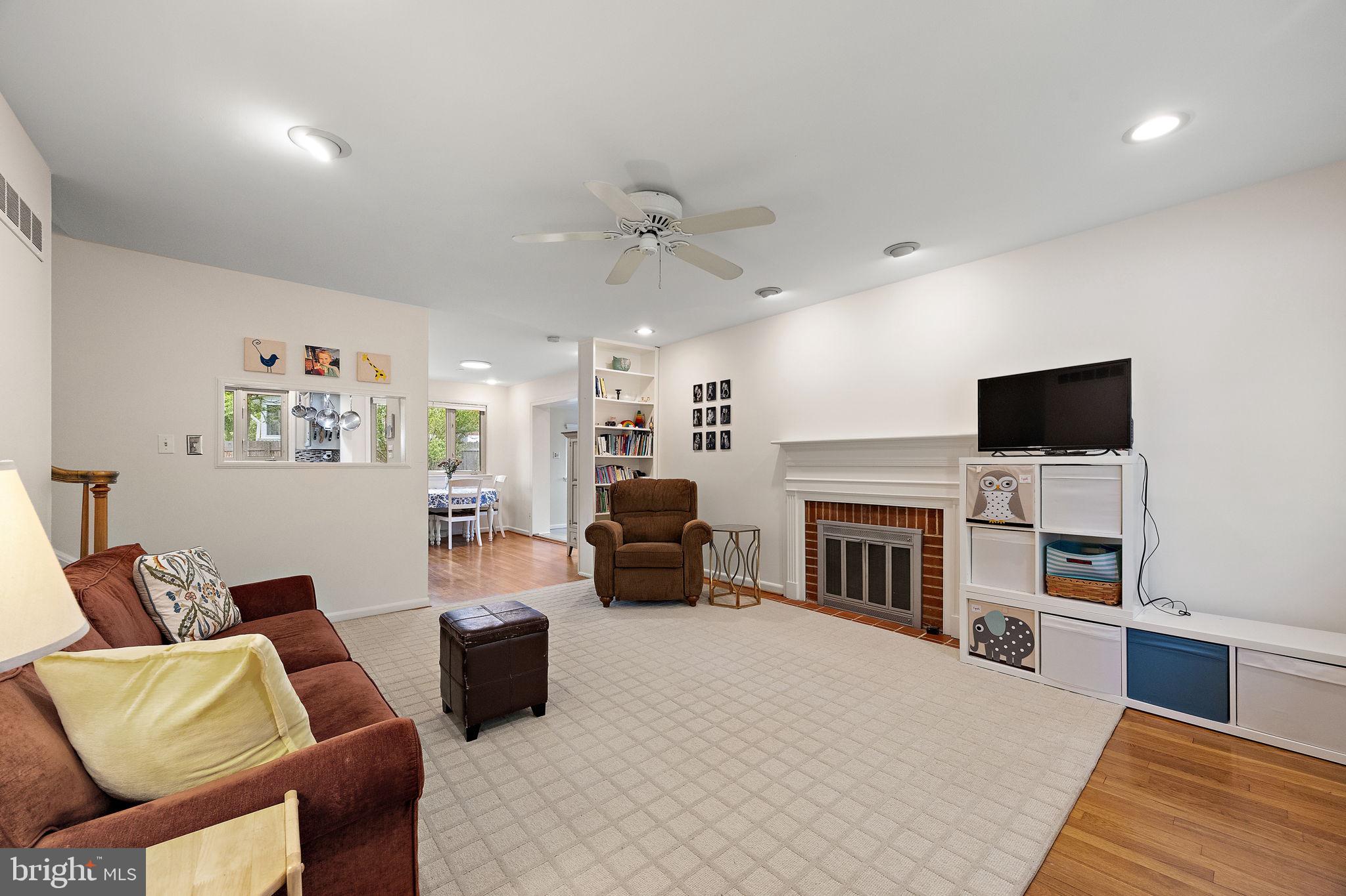 601 Riverview Road Claymont, DE 19703 - Photo 2 of 33 a living room with furniture fireplace and flat screen tv