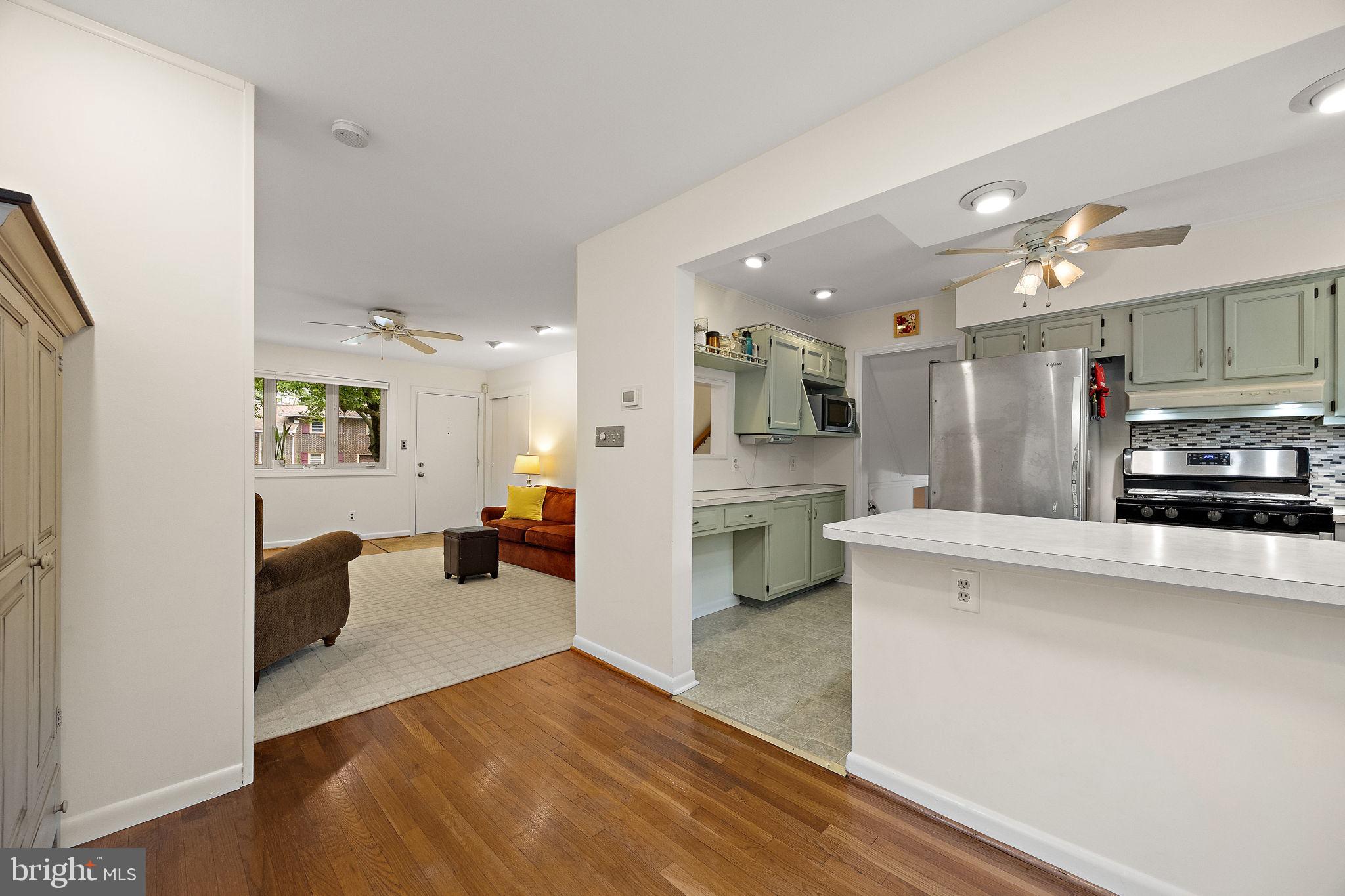 601 Riverview Road Claymont, DE 19703 - Photo 5 of 33 a view of kitchen with cabinets and wooden floor