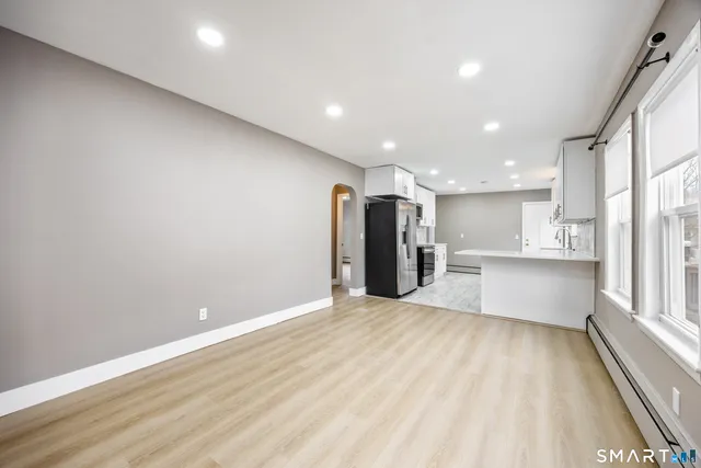 a view of an empty room with a window