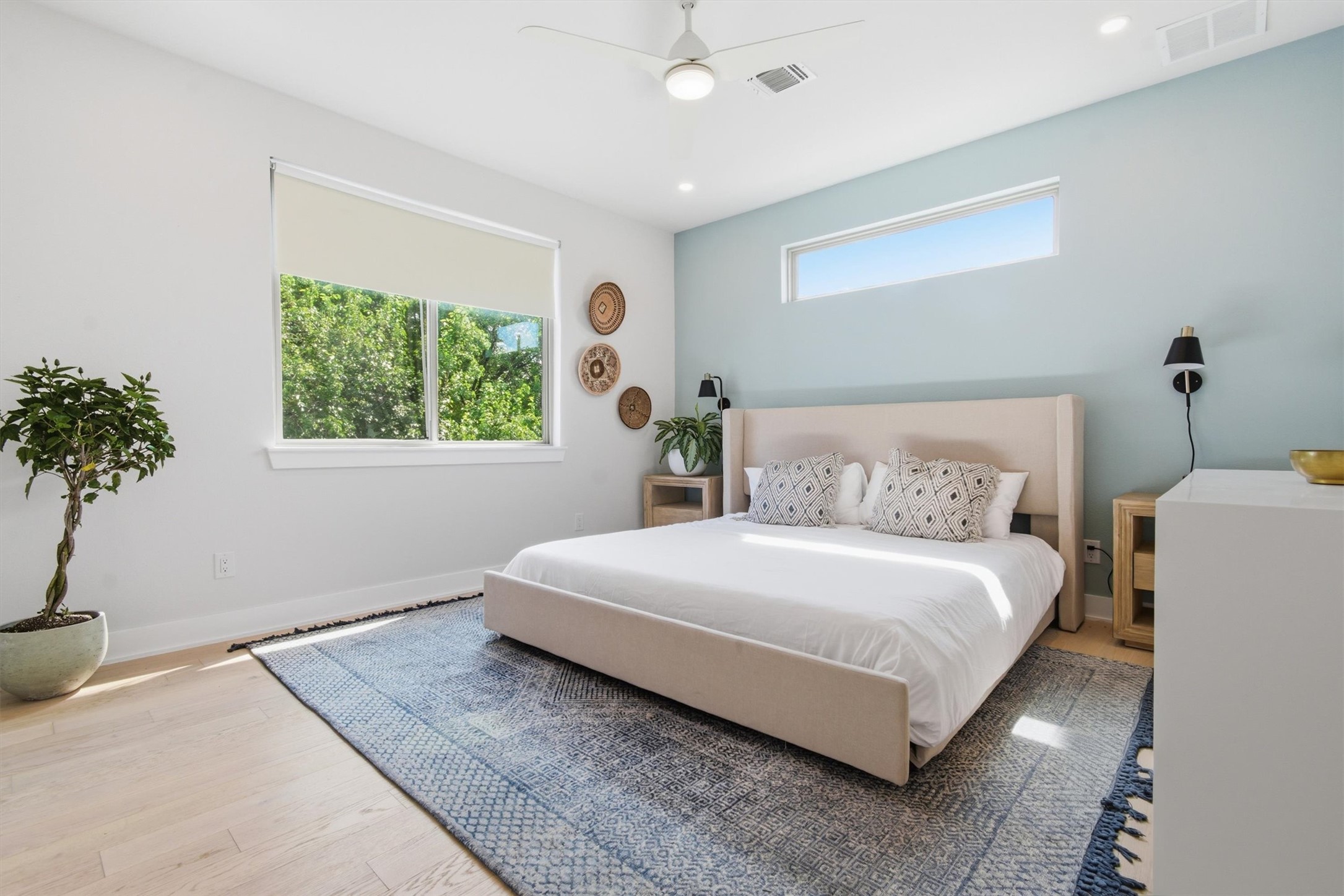 2710 Zaragosa Street, Unit A Austin, TX 78702 - Photo 14 of 29 Bold blue accent wall and oversized window make this a bright, productive home office or flex space.