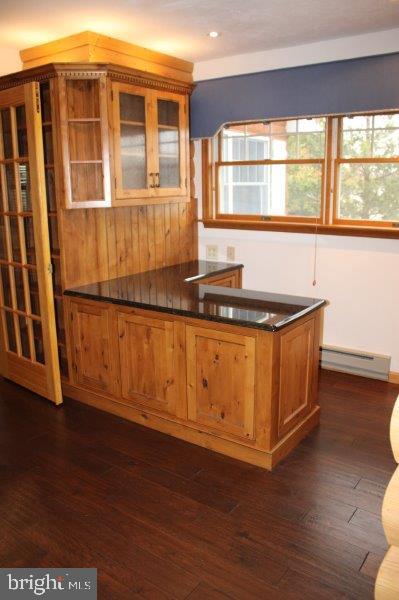 1400 Lisburn Road Wellsville, PA 17365 - Photo 5 of 9 a kitchen with granite countertop wooden cabinets and a wooden floor