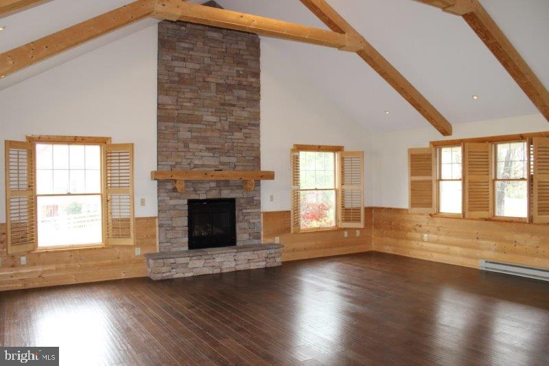 1400 Lisburn Road Wellsville, PA 17365 - Photo 6 of 9 a view of an empty room with wooden floor and a window