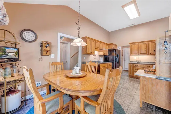 a spacious bedroom with a bed and a cabinet