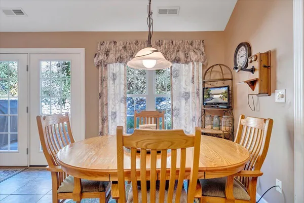 a bedroom with a bed and a dresser in it