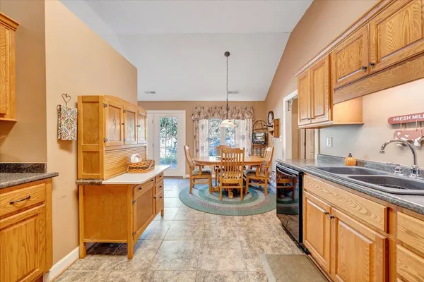 a large bathroom with a sink a mirror and a bathtub