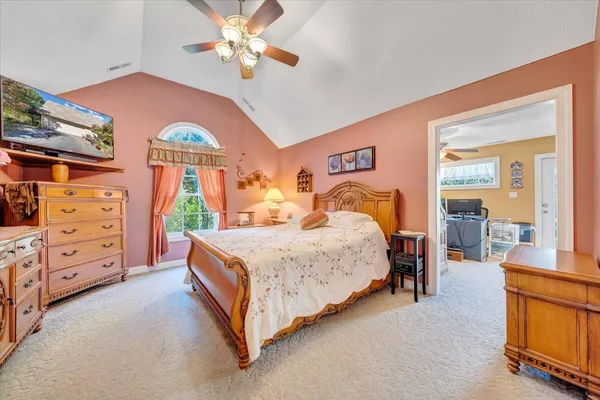 a bathroom with a tub sink and mirror