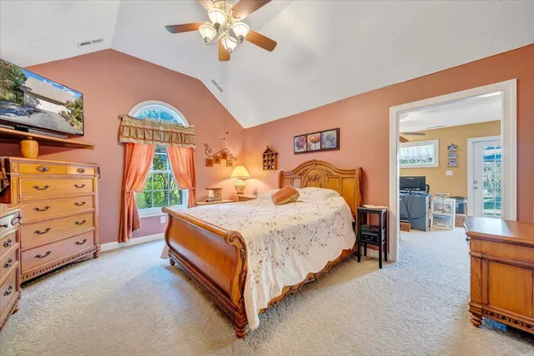 a view of walk in closet with clothes