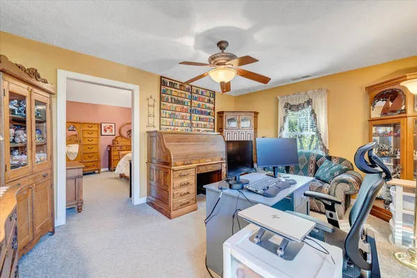 a bedroom with furniture and a chandelier