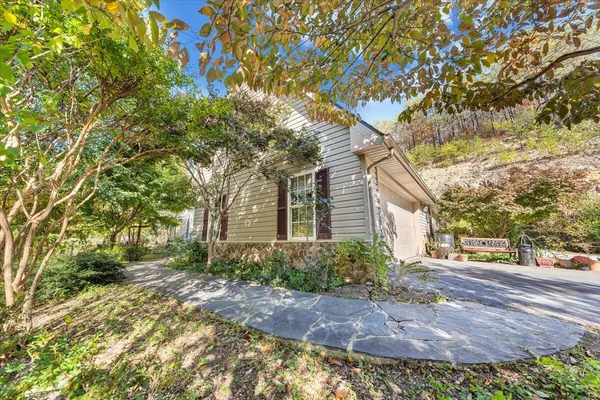 a backyard of a house with lots of green space and fog