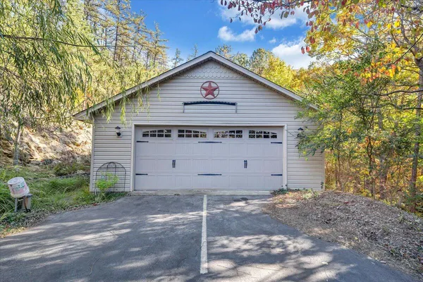 a view of a dry yard with mountains in the background