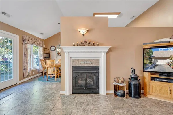 a dining room with furniture and window