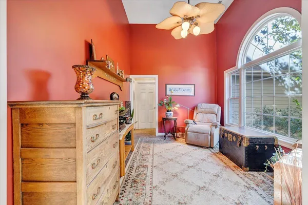 a dining room with furniture and a kitchen view