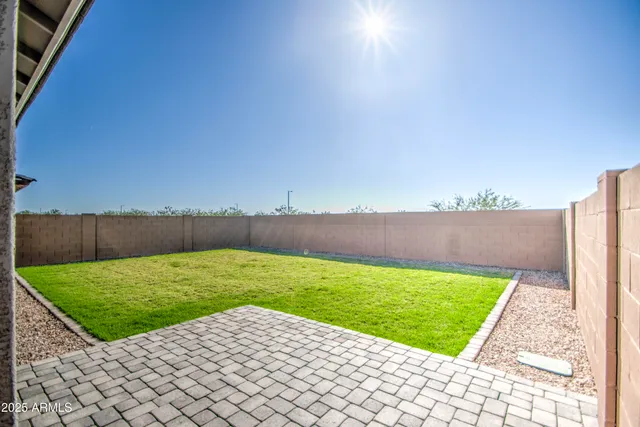 a view of a backyard with an outdoor space