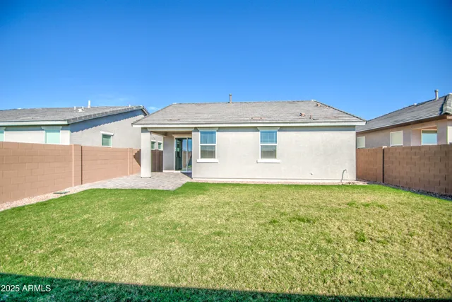 a view of an house with backyard porch and garden