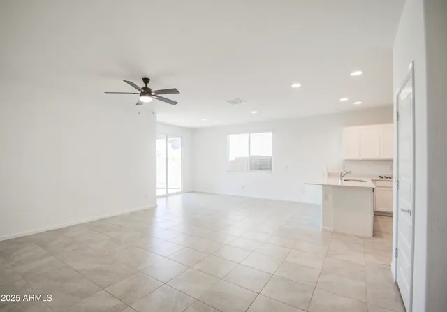 a view of a kitchen with a sink and cabinet window and a kitchen space