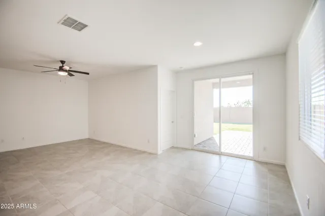 an empty room with a empty space and a window