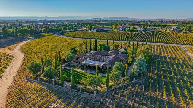 an aerial view of a house with a lake view