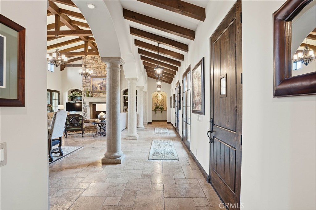 34965 Via Del Ponte Temecula Ca Temecula, CA 92592 - Photo 20 of 75 a view of a hallway with wooden floor and windows