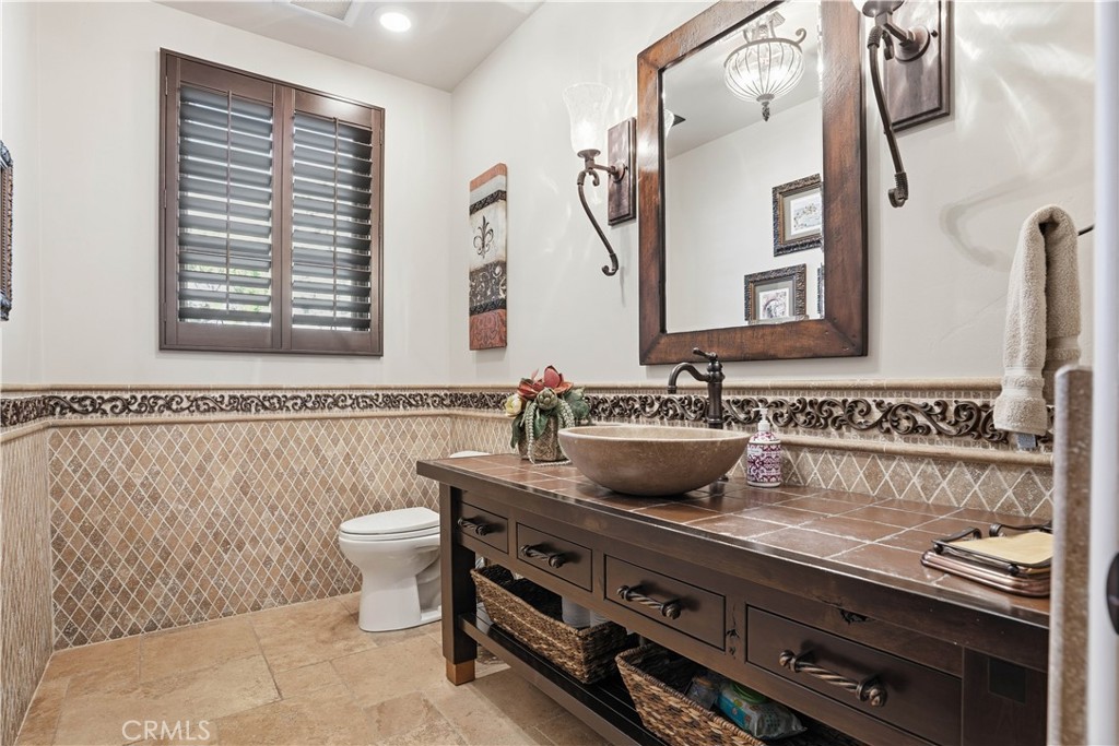 34965 Via Del Ponte Temecula Ca Temecula, CA 92592 - Photo 35 of 75 a bathroom with a sink and a mirror