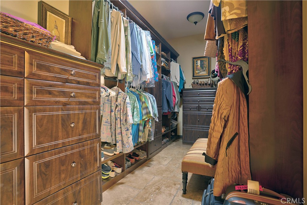 34965 Via Del Ponte Temecula Ca Temecula, CA 92592 - Photo 49 of 75 a view of walk in closet with clothes and shoes