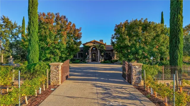 a front view of a building with a garden