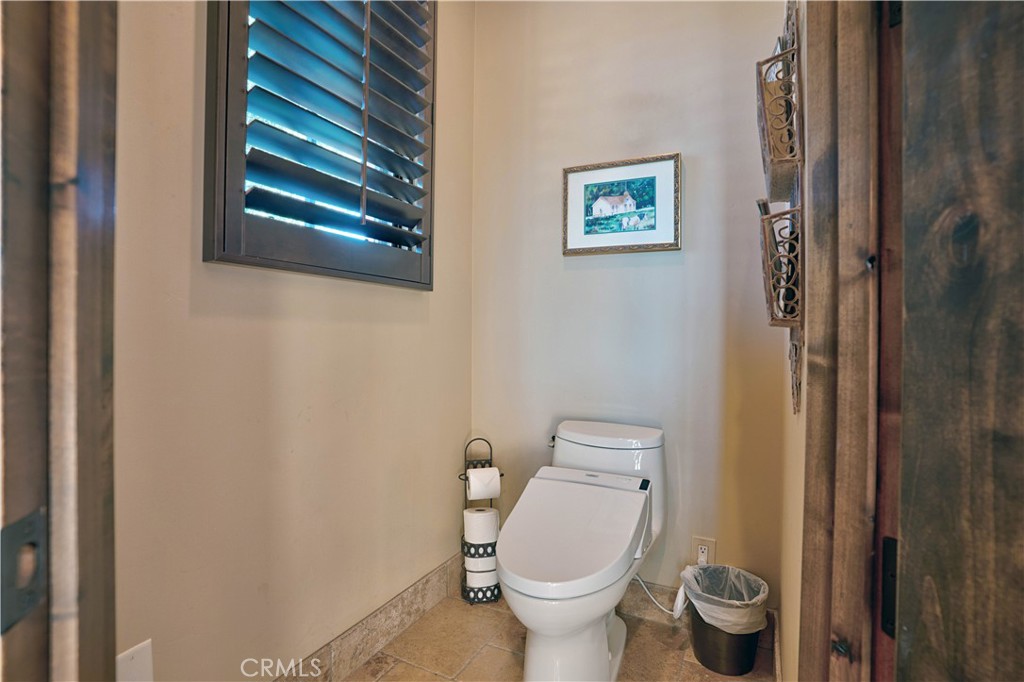 34965 Via Del Ponte Temecula Ca Temecula, CA 92592 - Photo 54 of 75 a white toilet sitting next to a small bathroom