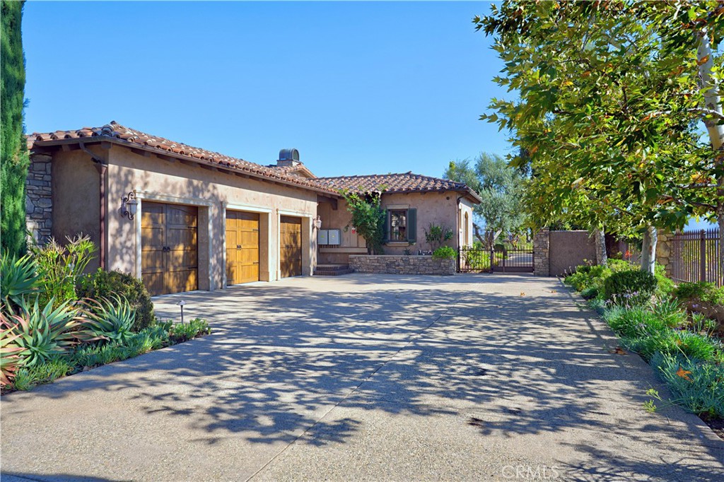 34965 Via Del Ponte Temecula Ca Temecula, CA 92592 - Photo 69 of 75 a front view of a house with a yard and potted plants