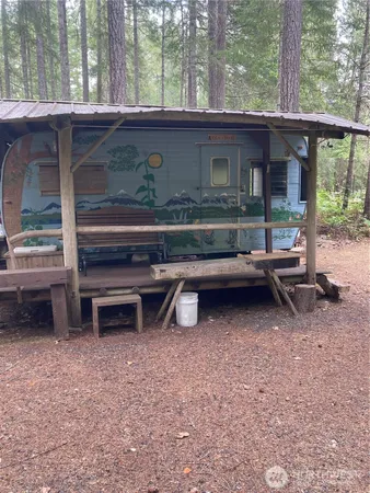front view of a house with a backyard