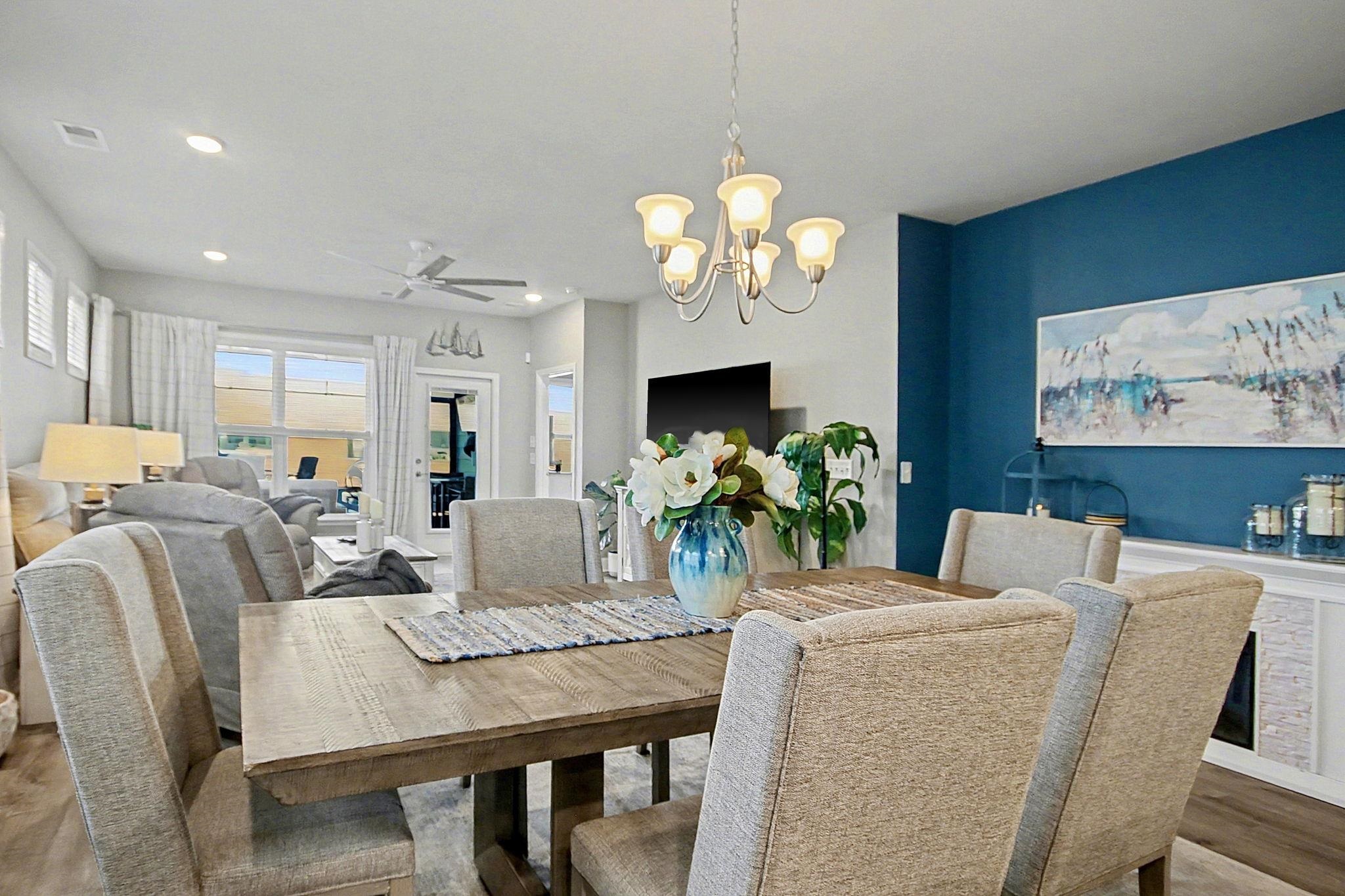 5830 Cremona Drive Myrtle Beach, SC 29577 - Photo 14 of 39 Dining area with wood finished floors, a ceiling fan, a chandelier, and recessed lighting