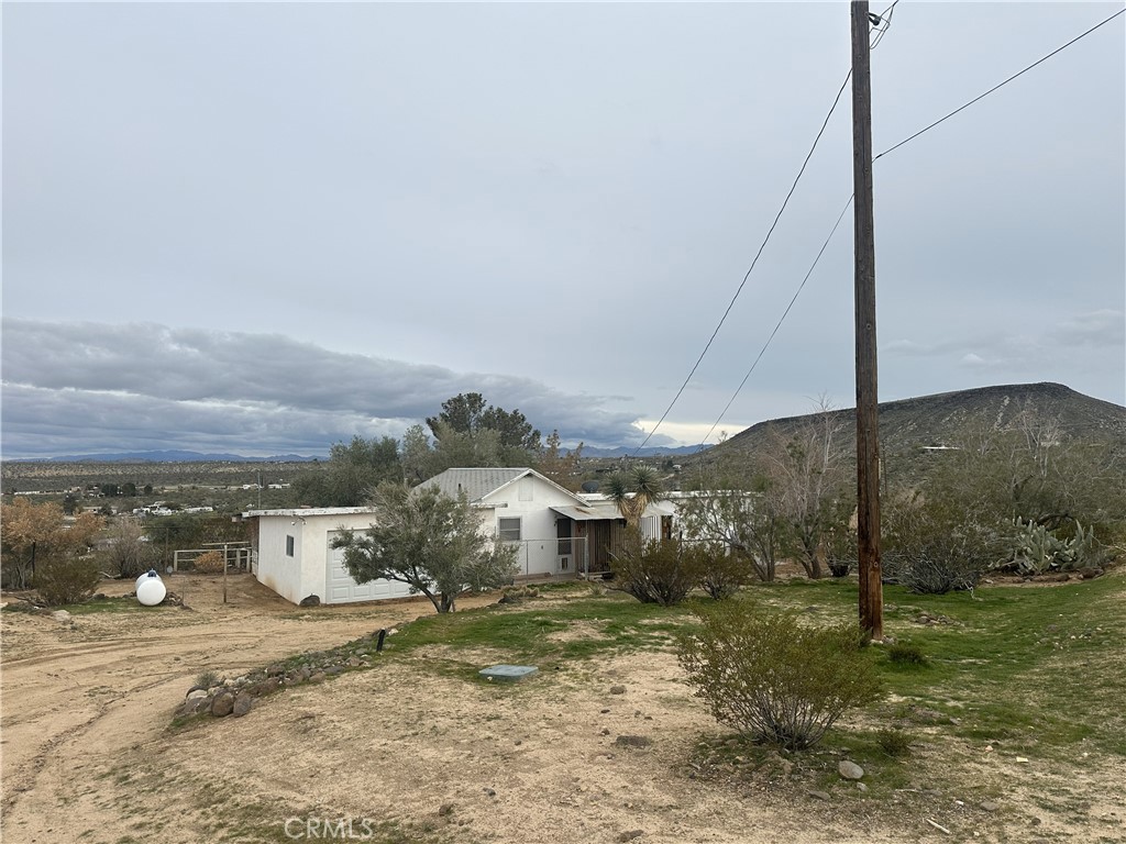 55710 Chaparral Road Yucca Valley, CA 92284 - Photo 1 of 18 a view of a barn