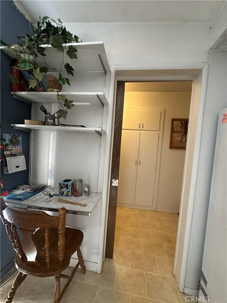 55710 Chaparral Road Yucca Valley, CA 92284 - Photo 15 of 18 a room with a cabinets and appliances