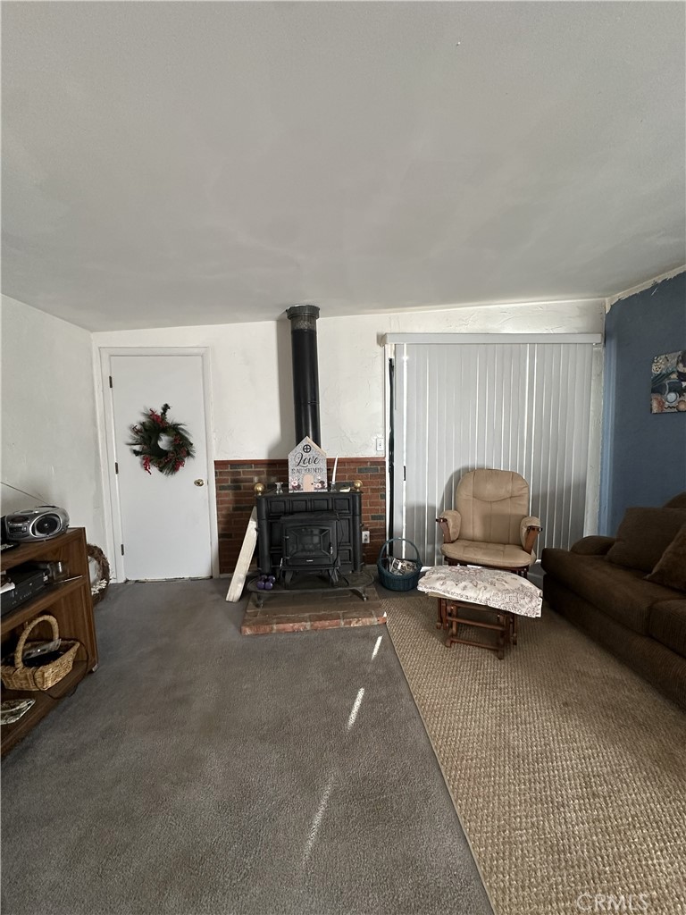 55710 Chaparral Road Yucca Valley, CA 92284 - Photo 7 of 18 a living room with furniture and a couch