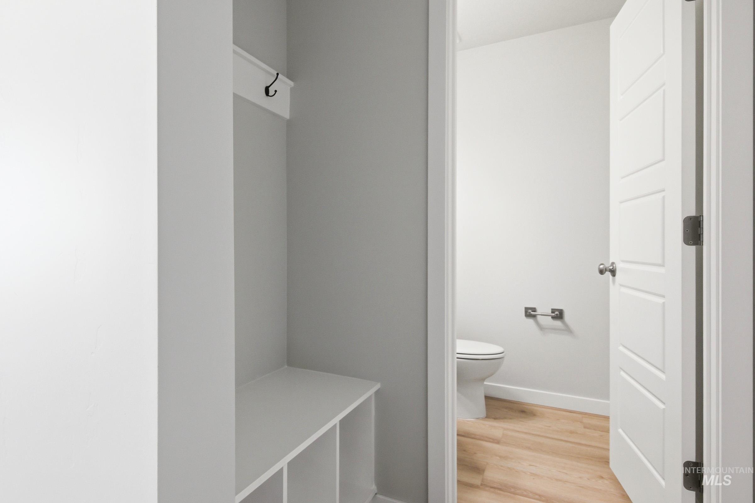 10812 Rutland Street Caldwell, ID 83605 - Photo 13 of 21 Built-in mudroom bench with cubby storage and wall-mounted hooks