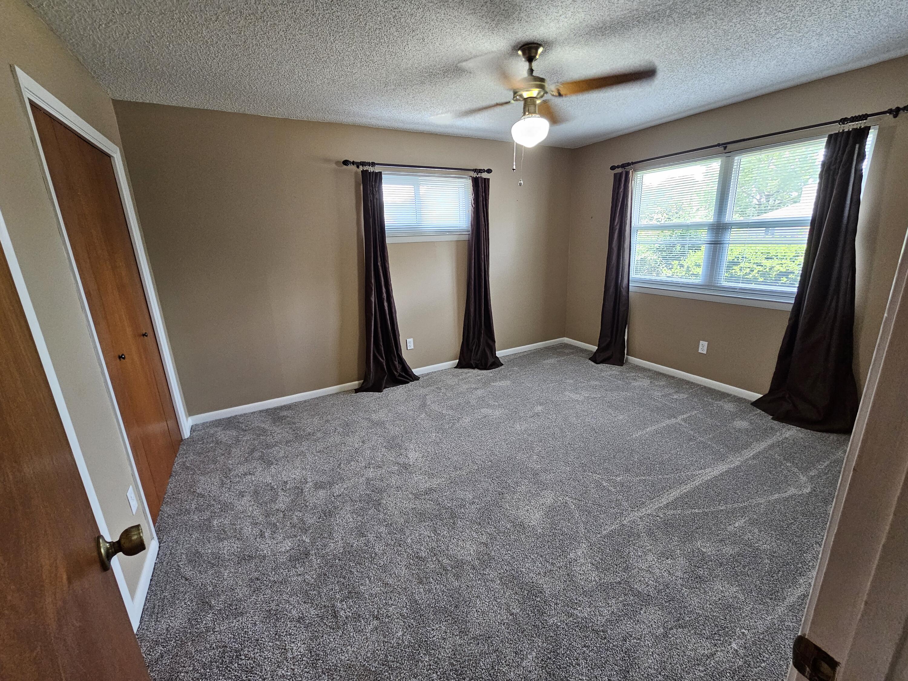 129 12th Avenue Shalimar, FL 32579 - Photo 17 of 36 wooden floor in an empty room with a window