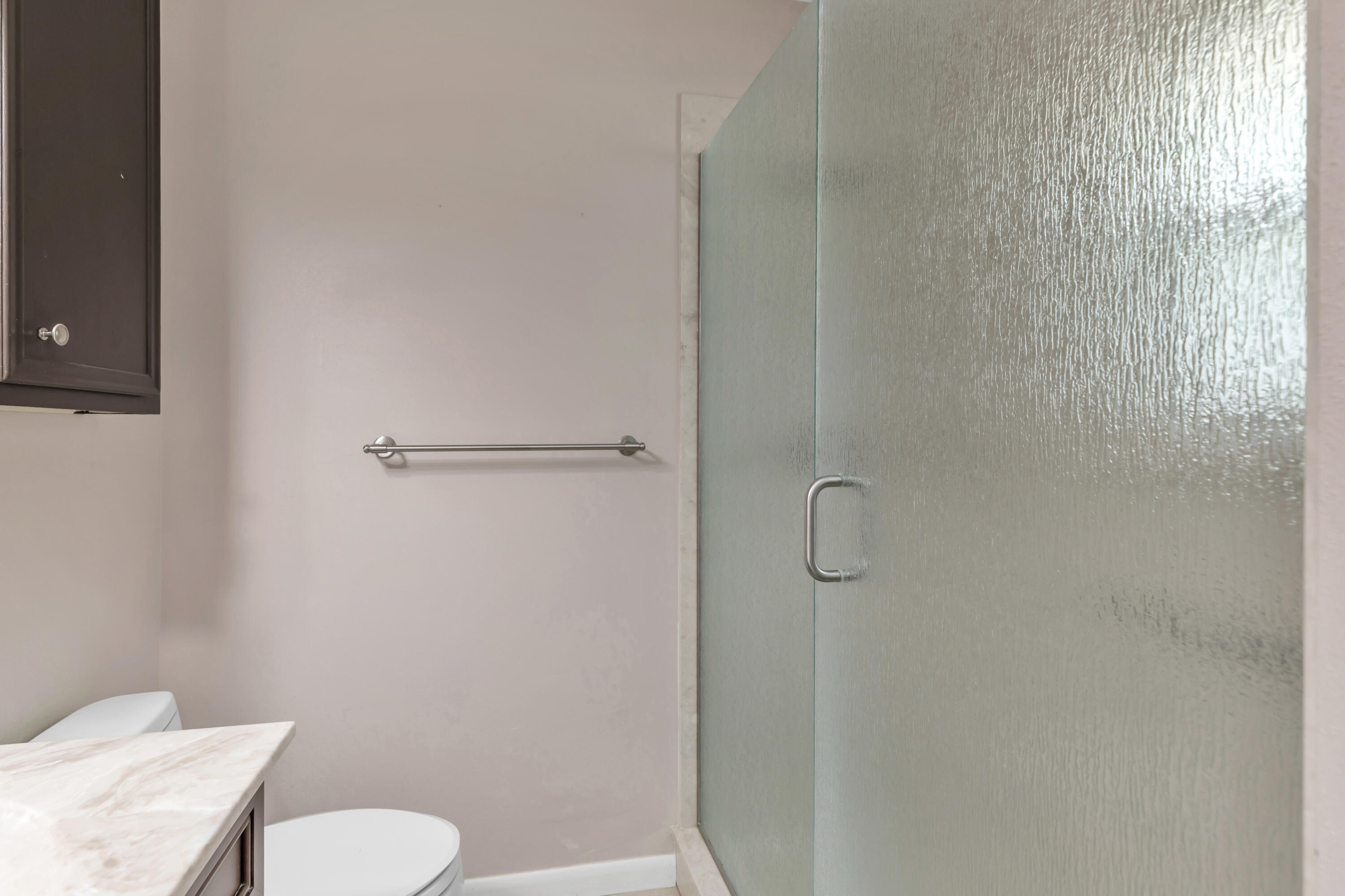 129 12th Avenue Shalimar, FL 32579 - Photo 28 of 36 a bathroom with a toilet and shower