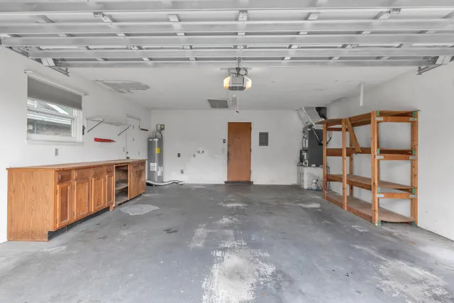 a front view of a house with a yard and a garage