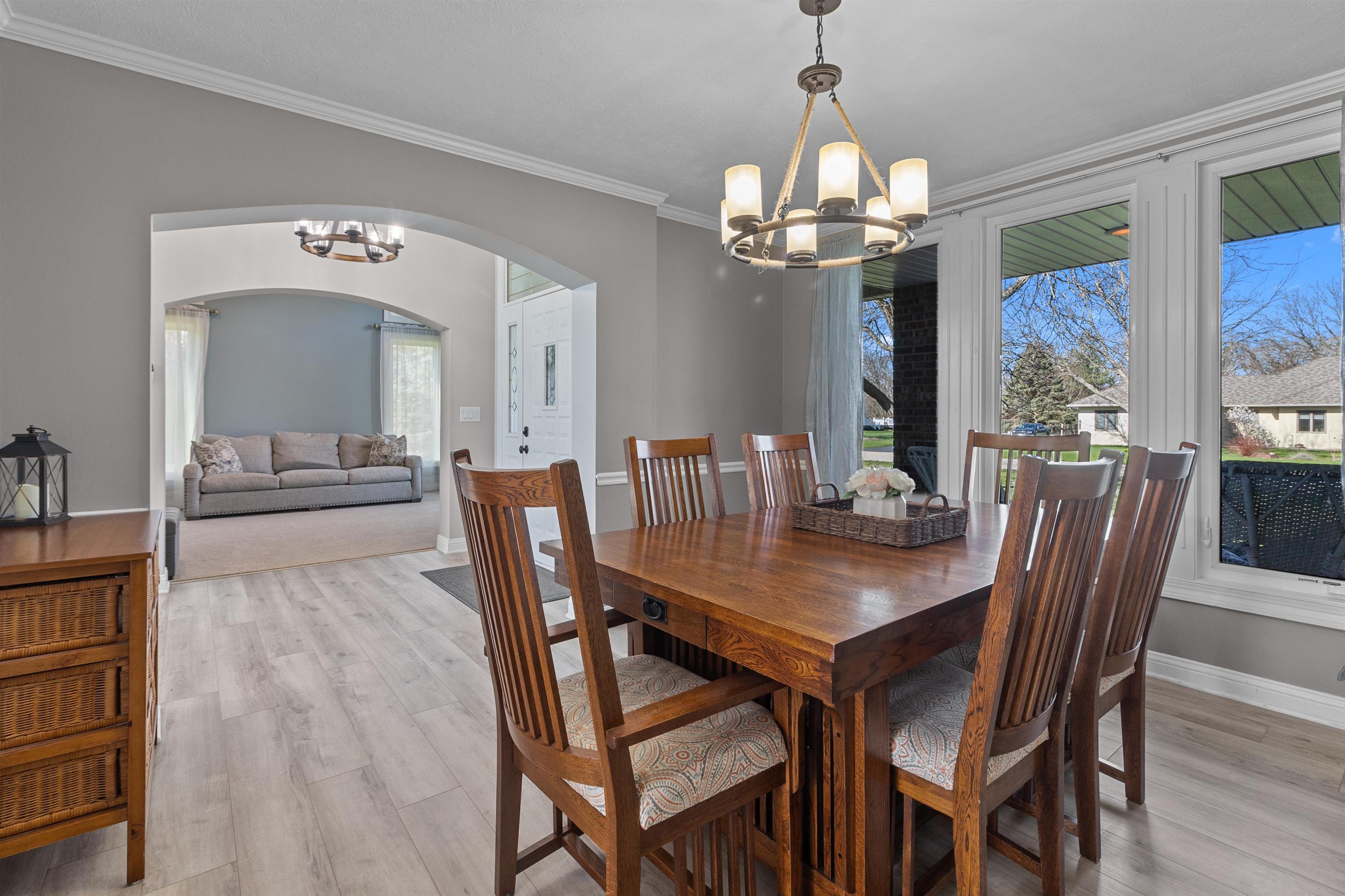 11857 Lerwick Road Caledonia, IL 61011 - Photo 20 of 72 a view of a dining room with furniture a chandelier and wooden floor