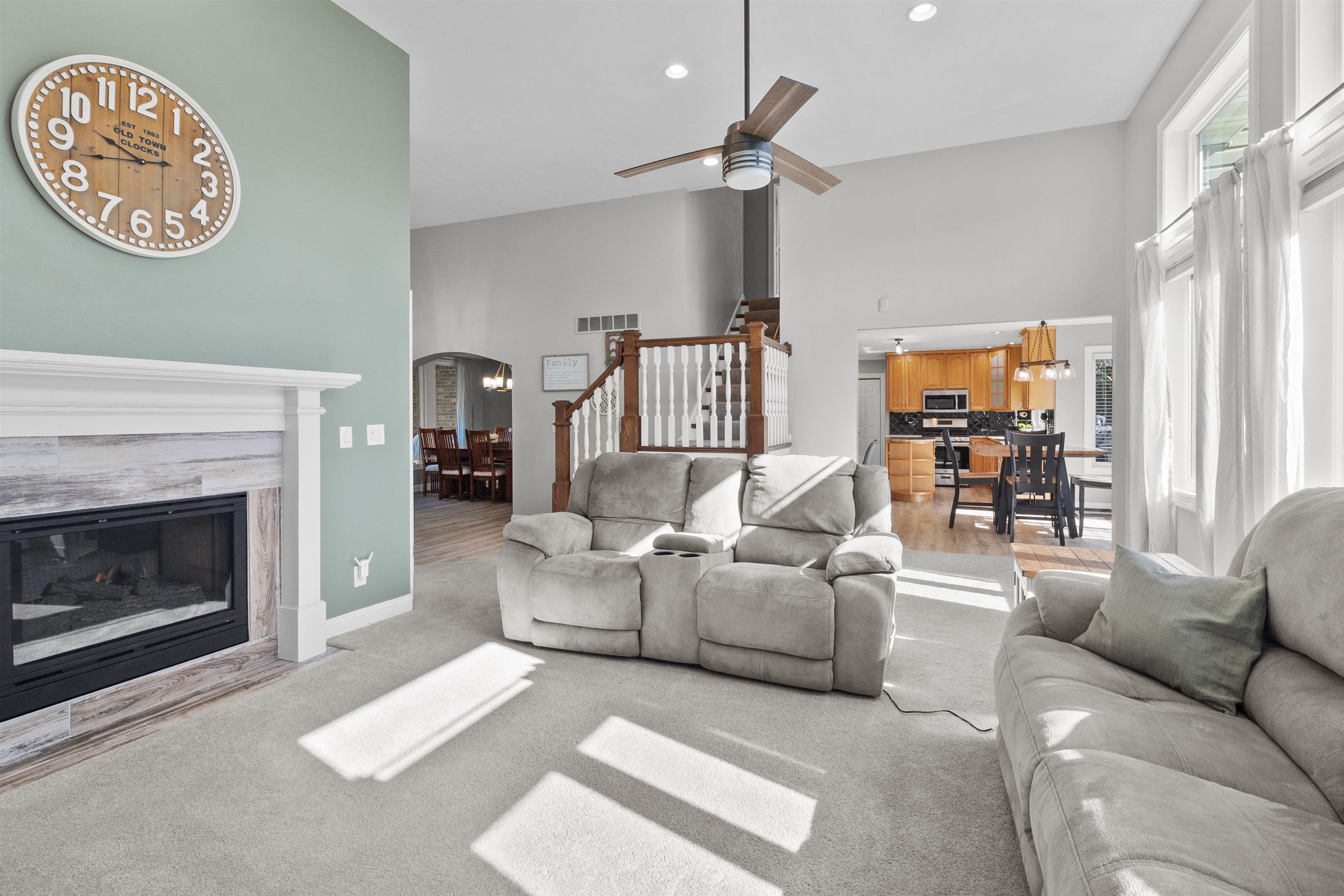11857 Lerwick Road Caledonia, IL 61011 - Photo 23 of 72 a living room with furniture a chandelier and a fireplace