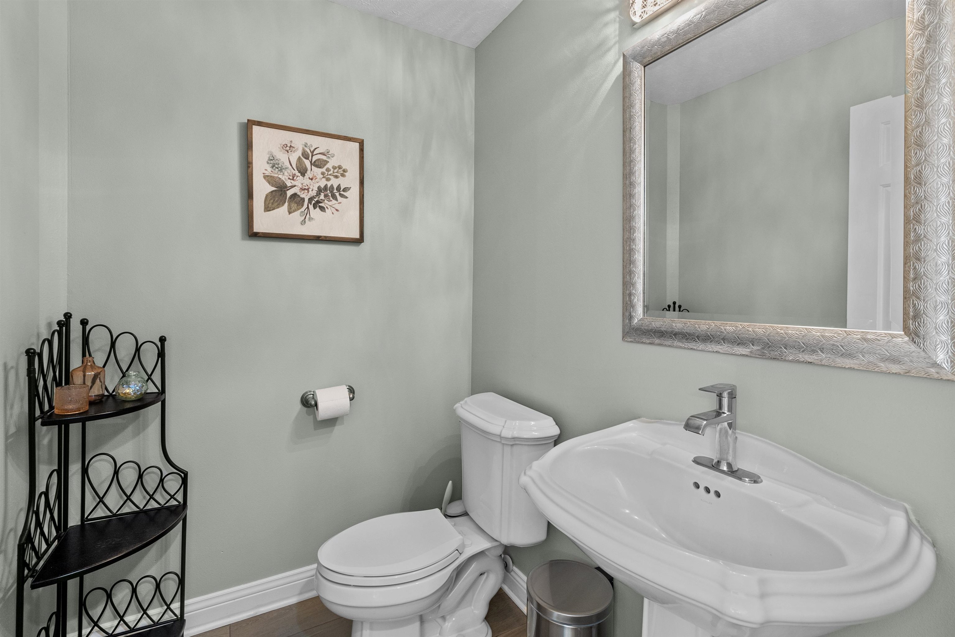 11857 Lerwick Road Caledonia, IL 61011 - Photo 38 of 72 a bathroom with a toilet a sink and a mirror