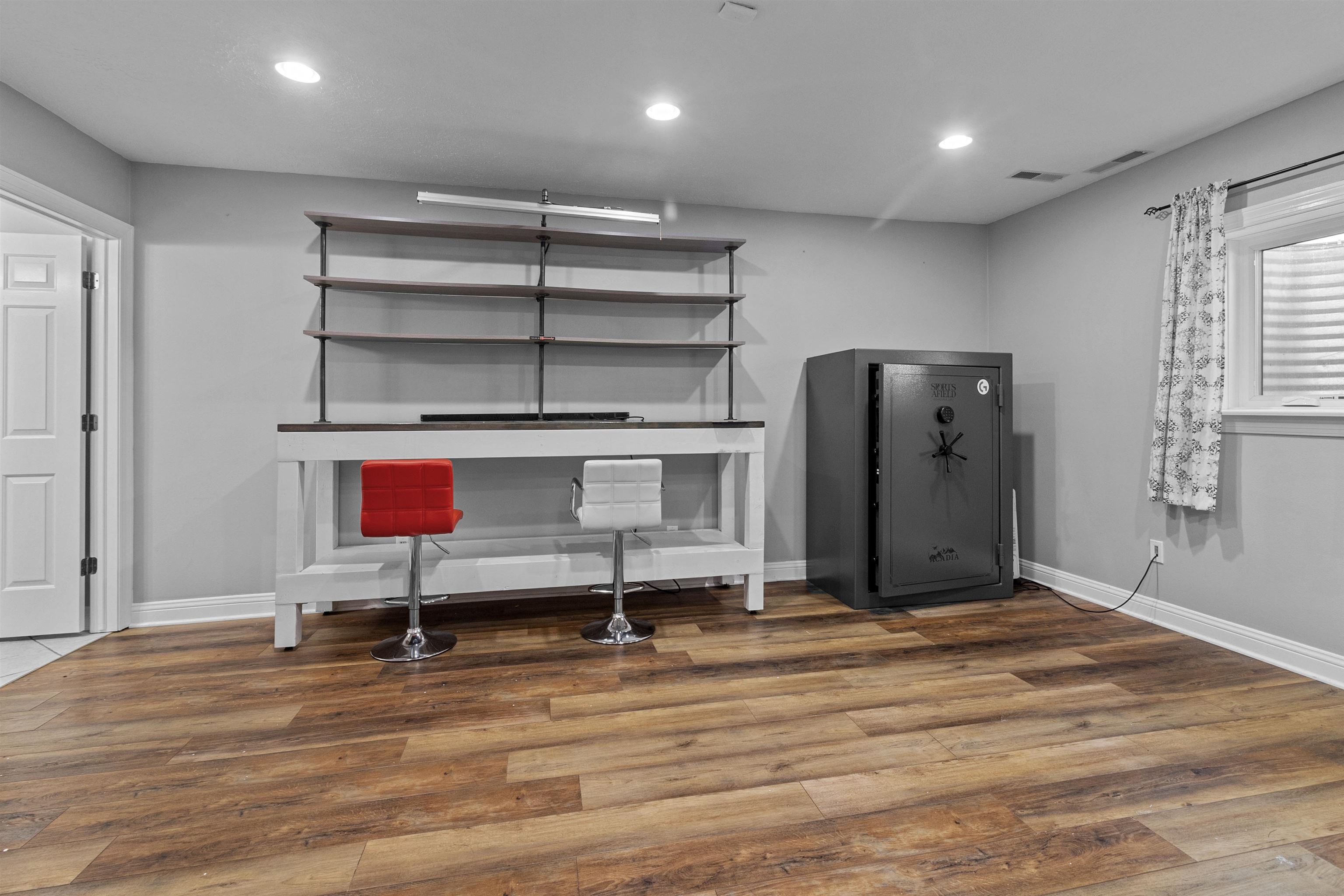 11857 Lerwick Road Caledonia, IL 61011 - Photo 49 of 72 a view of a room with wooden floor and cabinet