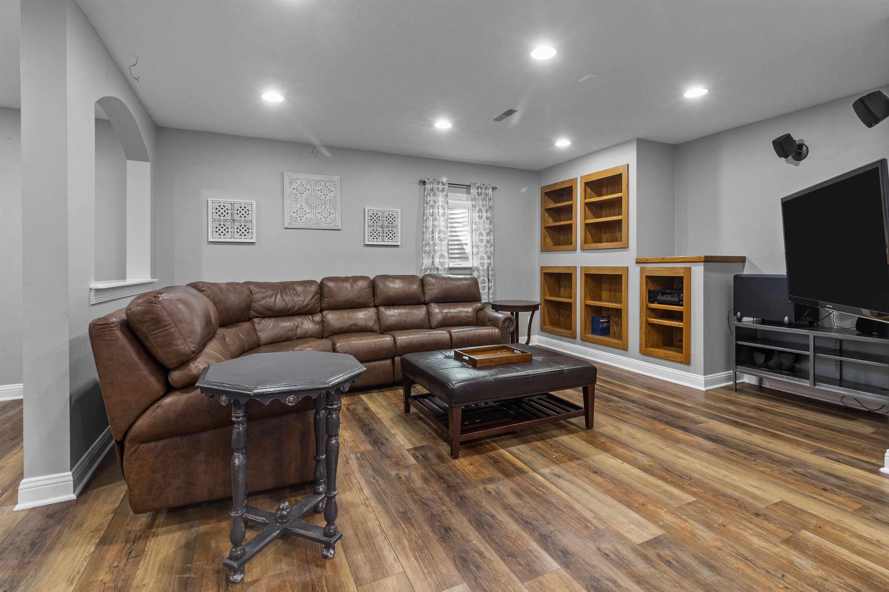 11857 Lerwick Road Caledonia, IL 61011 - Photo 54 of 72 a living room with furniture and a flat screen tv