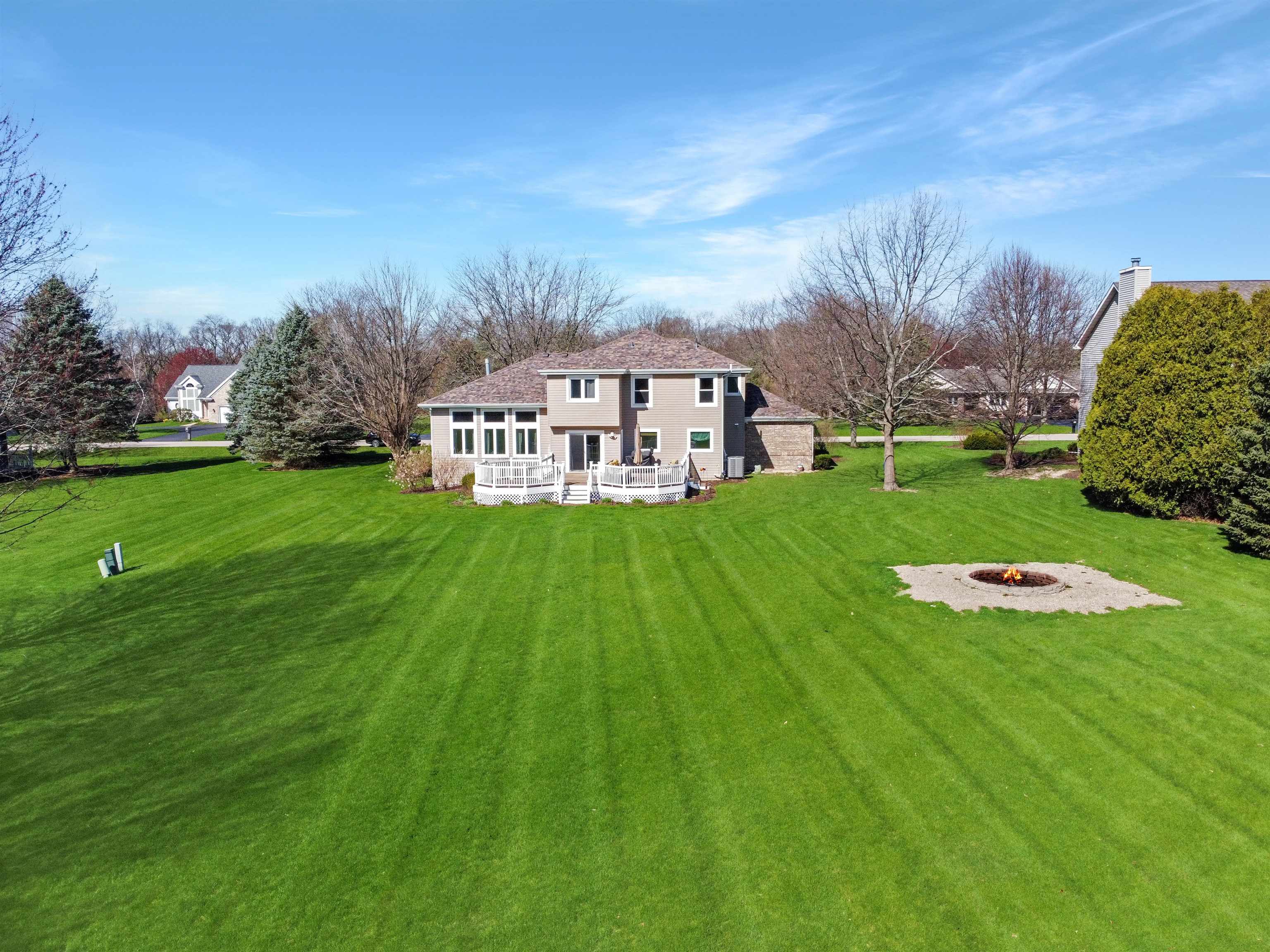 11857 Lerwick Road Caledonia, IL 61011 - Photo 71 of 72 a view of a house with a big yard and large trees