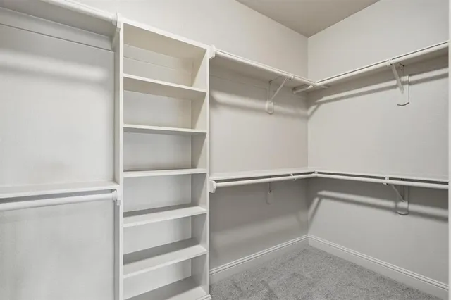 a view of an empty walk in closet