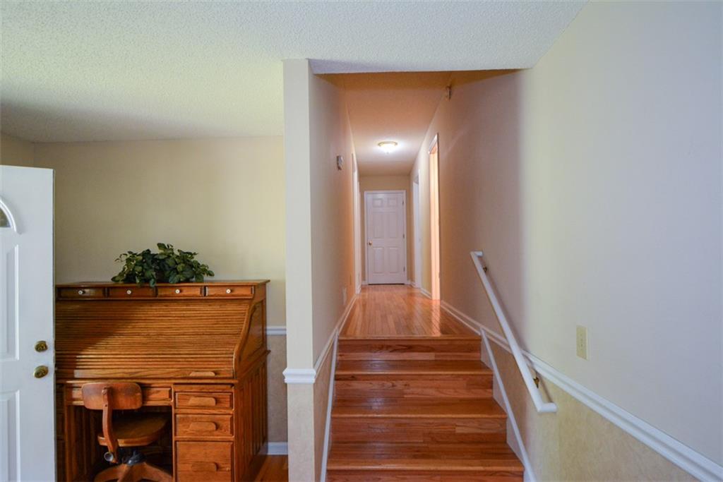 41 Clark Station Road Jasper, GA 30143 - Photo 17 of 69 a view of a hallway with wooden floor and staircase