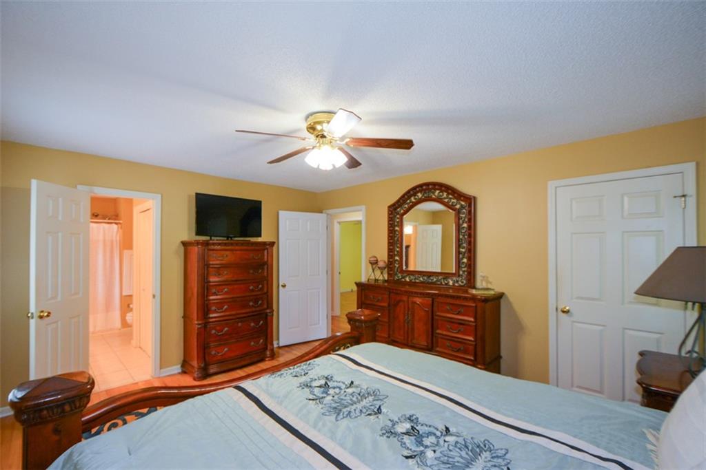 41 Clark Station Road Jasper, GA 30143 - Photo 29 of 69 a bedroom with a bed and a flat screen tv