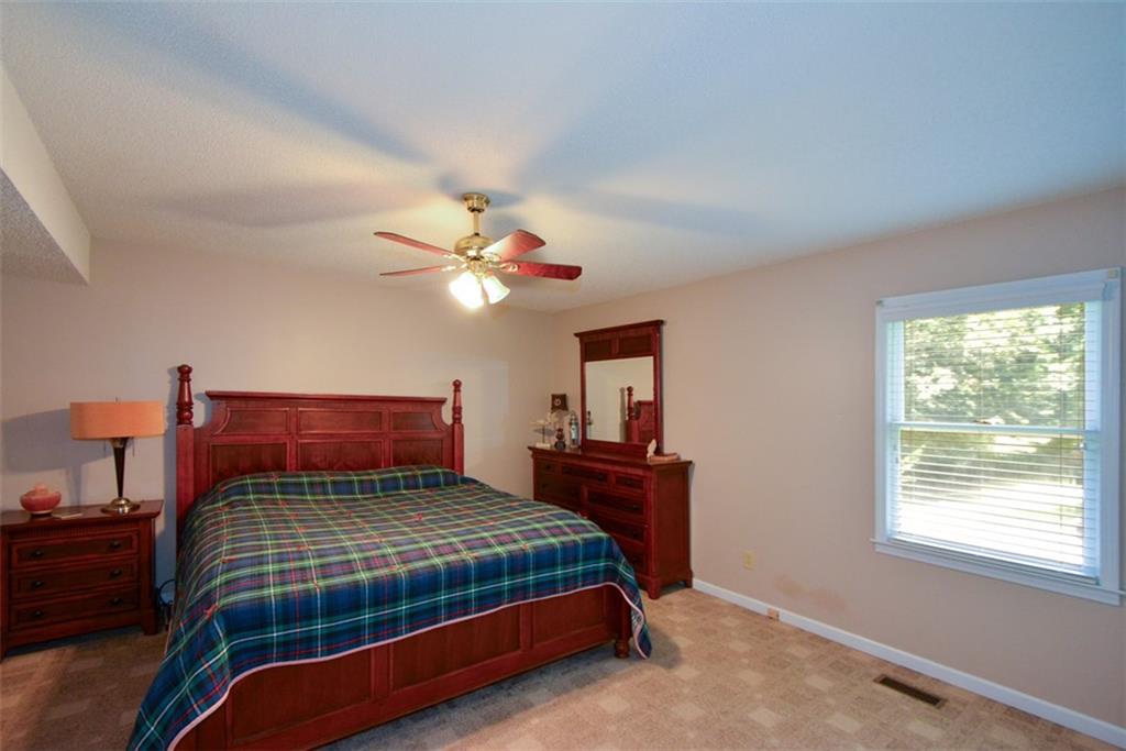 41 Clark Station Road Jasper, GA 30143 - Photo 32 of 69 a bedroom with a bed and window