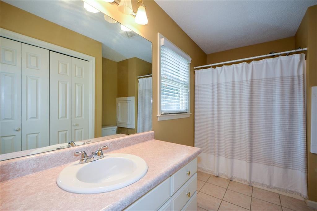 41 Clark Station Road Jasper, GA 30143 - Photo 36 of 69 a bathroom with a sink and a mirror