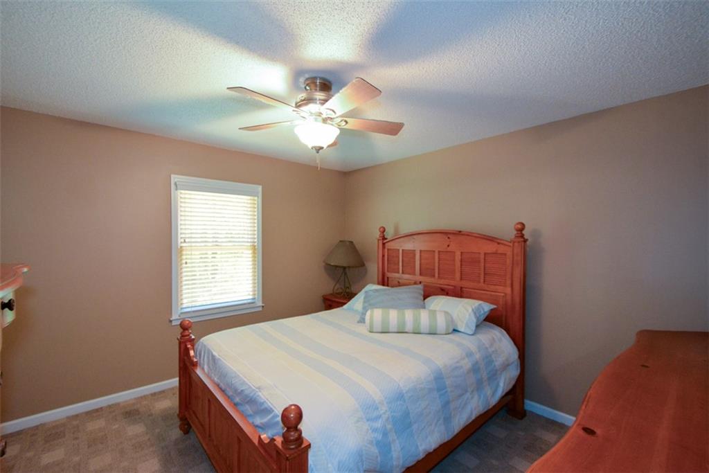 41 Clark Station Road Jasper, GA 30143 - Photo 37 of 69 a bedroom with a bed and a window