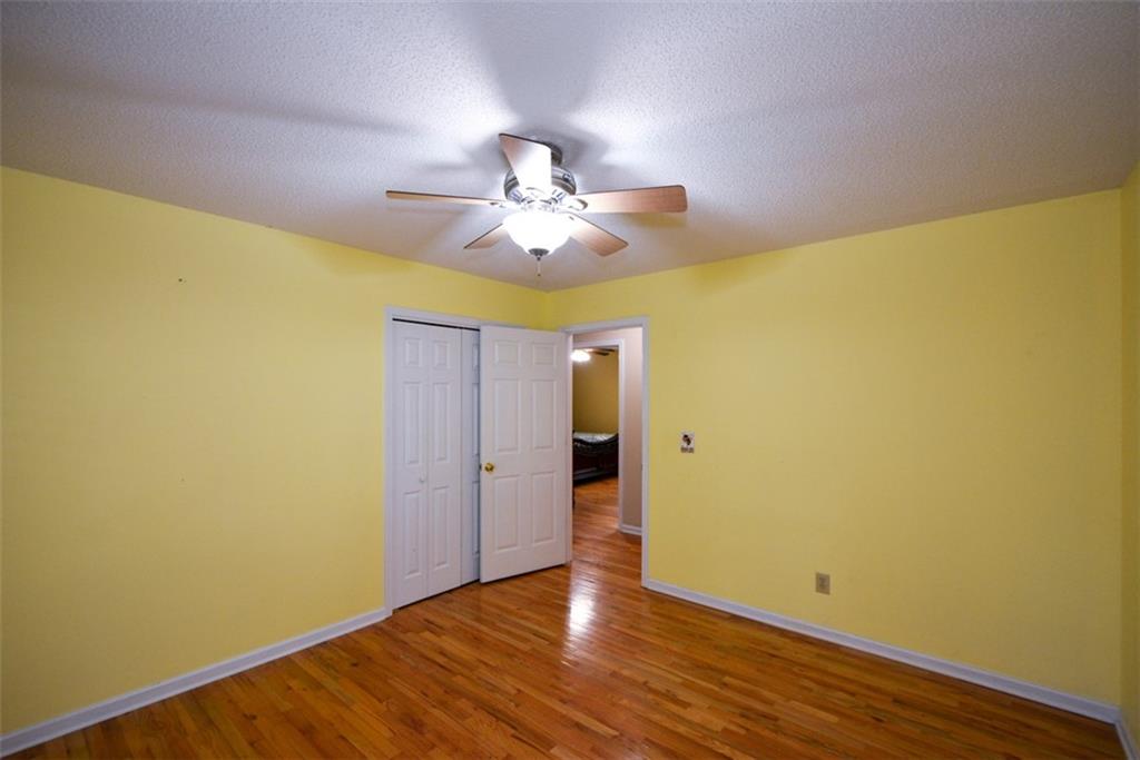 41 Clark Station Road Jasper, GA 30143 - Photo 53 of 69 a view of an empty room with a window and wooden floor